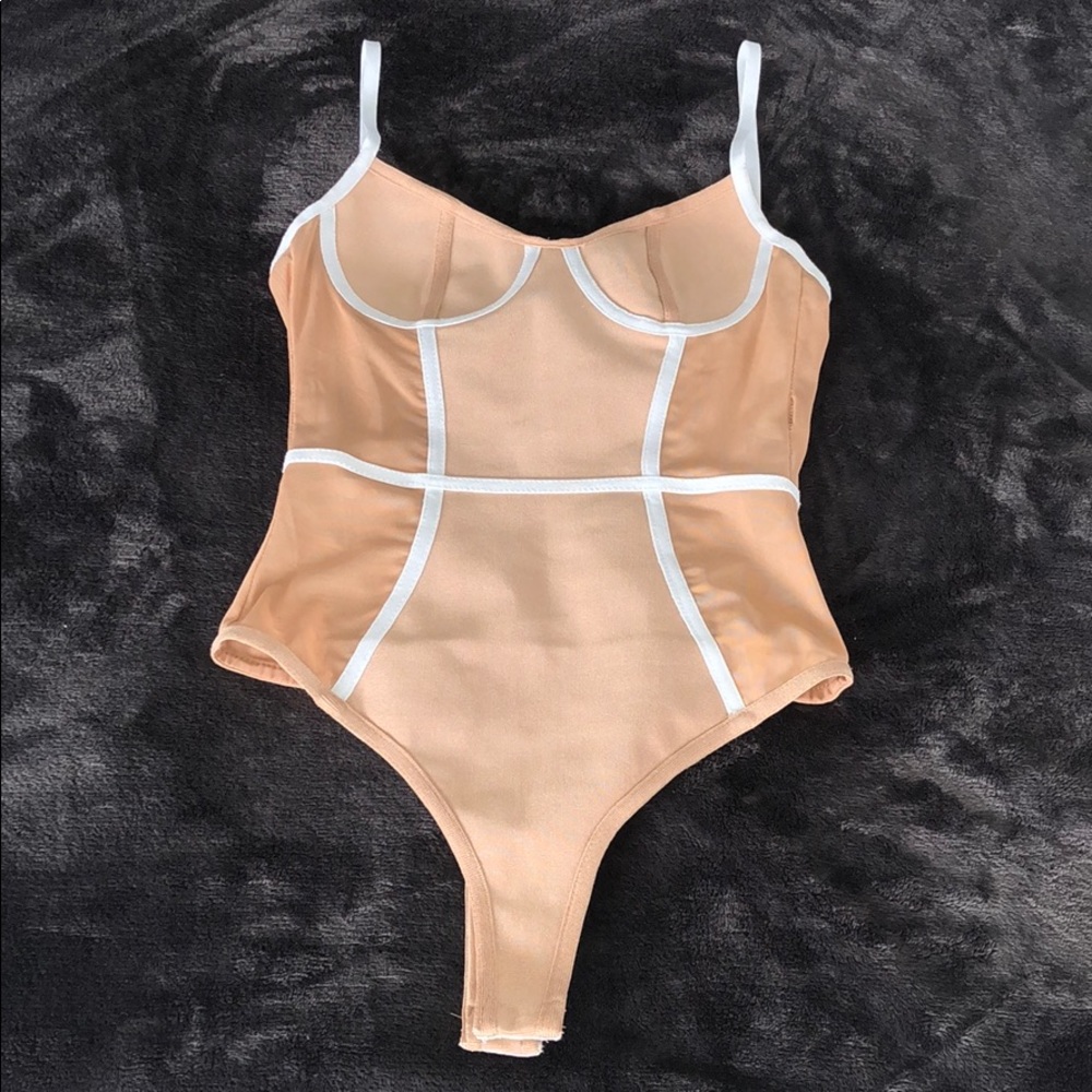 Nude and white body suit